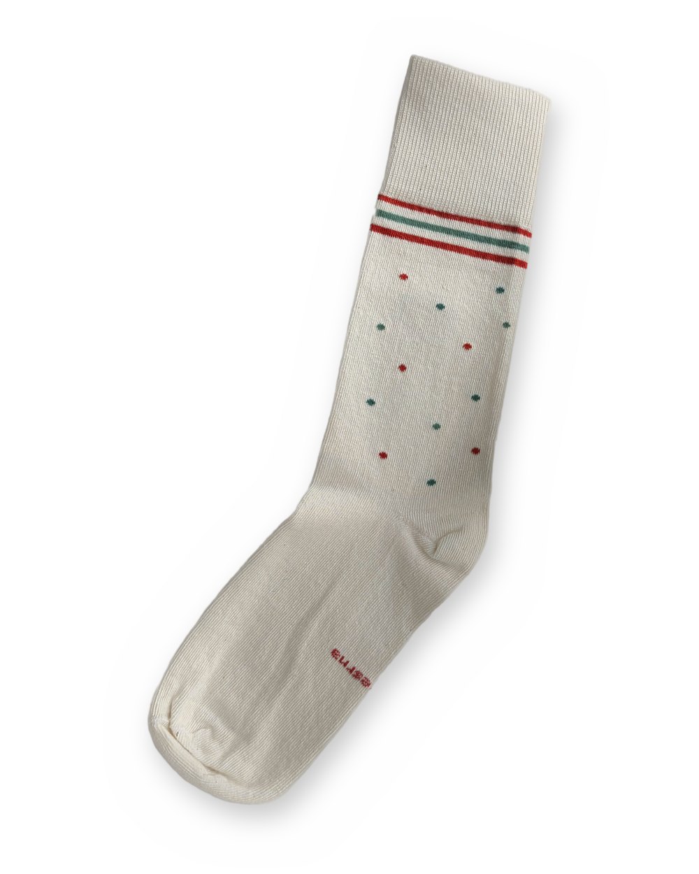 One Care Sock showing red and teal dots scattered down the leg.