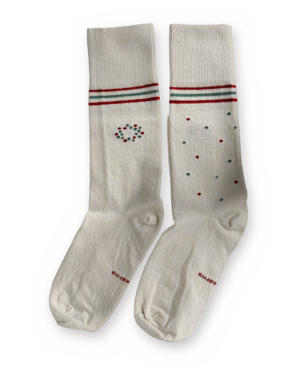 The two Care Socks laid flat: the circle of dots and the scattered dots.